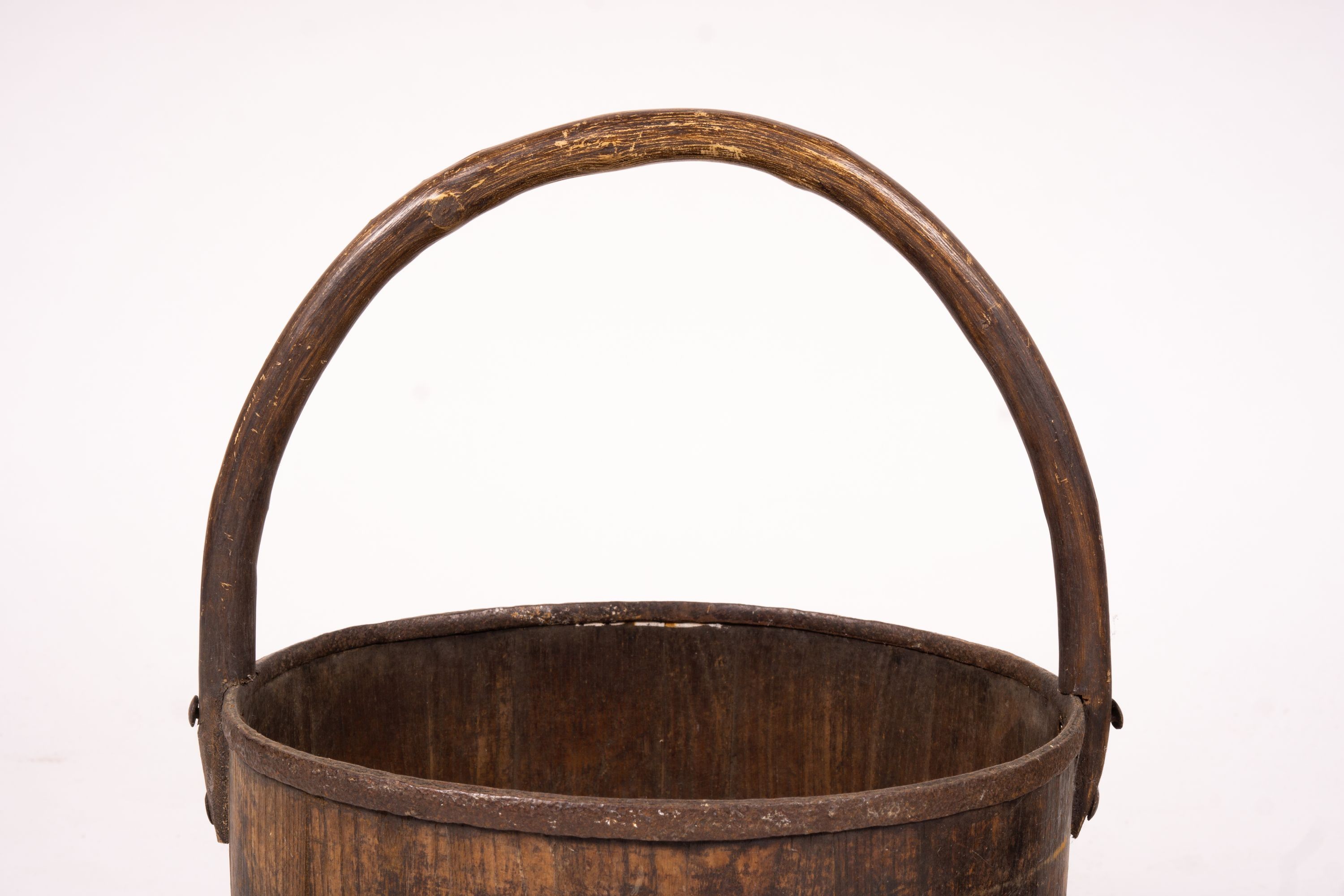 A Chinese staved wood rice carrier together with a circular iron bound staved wood bucket, larger 35cm diameter, height 52cm